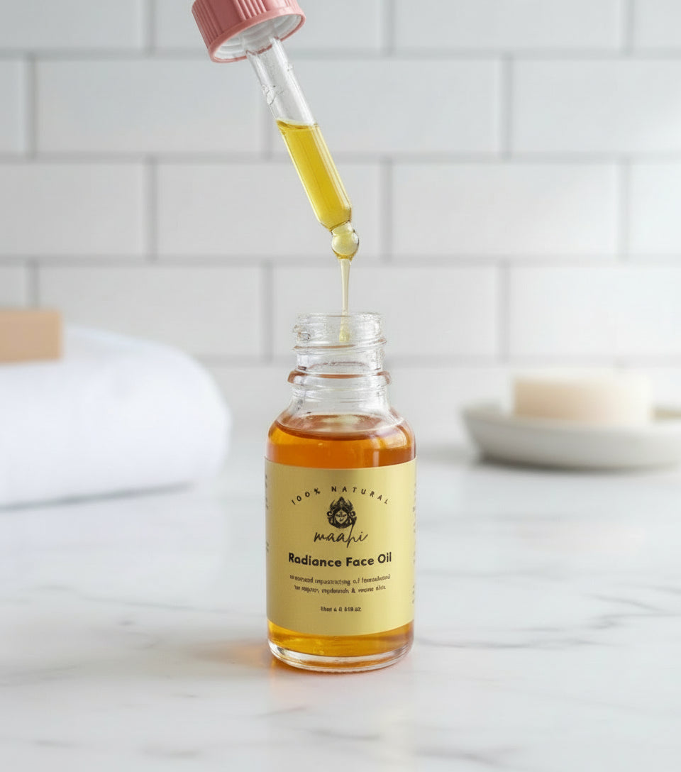Bottle of Radiance Face Oil with a dropper on a wooden surface